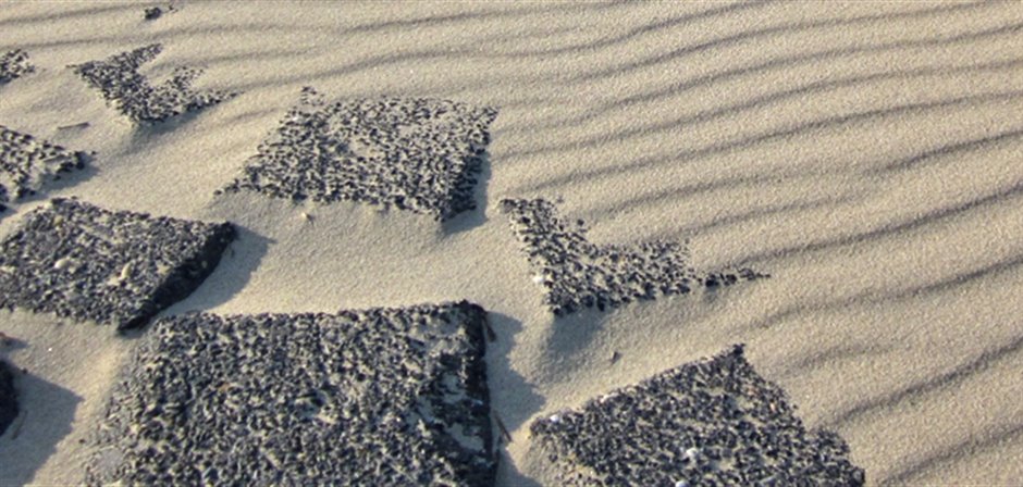 Stenen op het zand